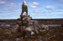 Inuksuk carrying a message (indicated by the white stones) in the Arviat area, Keewatin, 1990
…